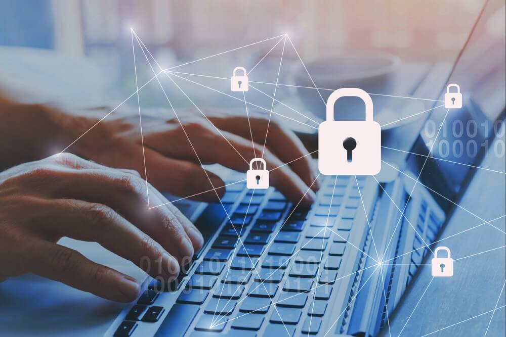 Padlock icons over hands typing on a laptop